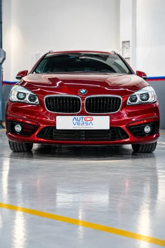 Glossy-Red-BMW-in-Modern-Garage